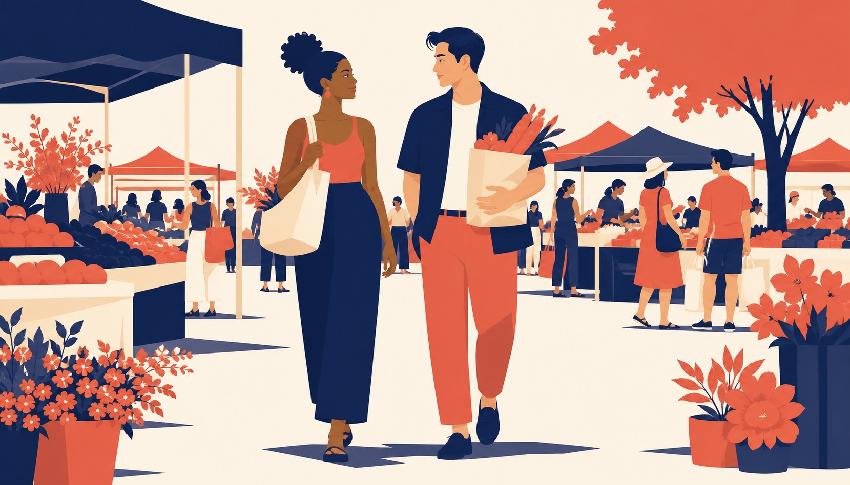 A couple in their thirties talking at a farmers market produce stall, he's holding a paper bag of vegetables, other shoppers blurred in the background