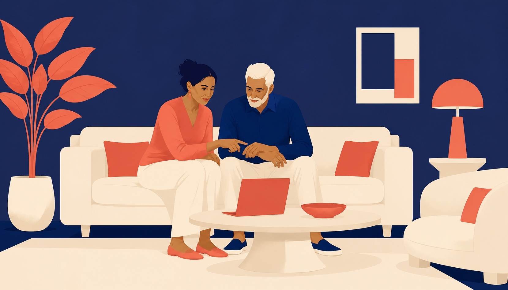 A couple sitting on a sofa in front of a navy wall, reading something together on an open laptop
