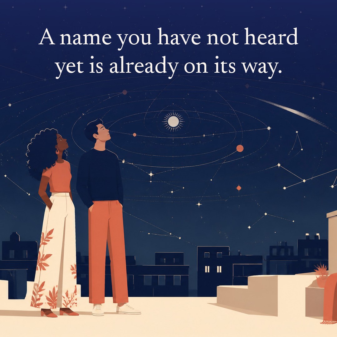 “A name you have not heard yet is already on its way.” A couple, two adults standing together on a city rooftop above a low skyline at night, beneath a vast star field, delicate constellation lines, faint concentric orbital rings and one long comet arc across a deep navy night sky, with a crescent moon low at one side.
