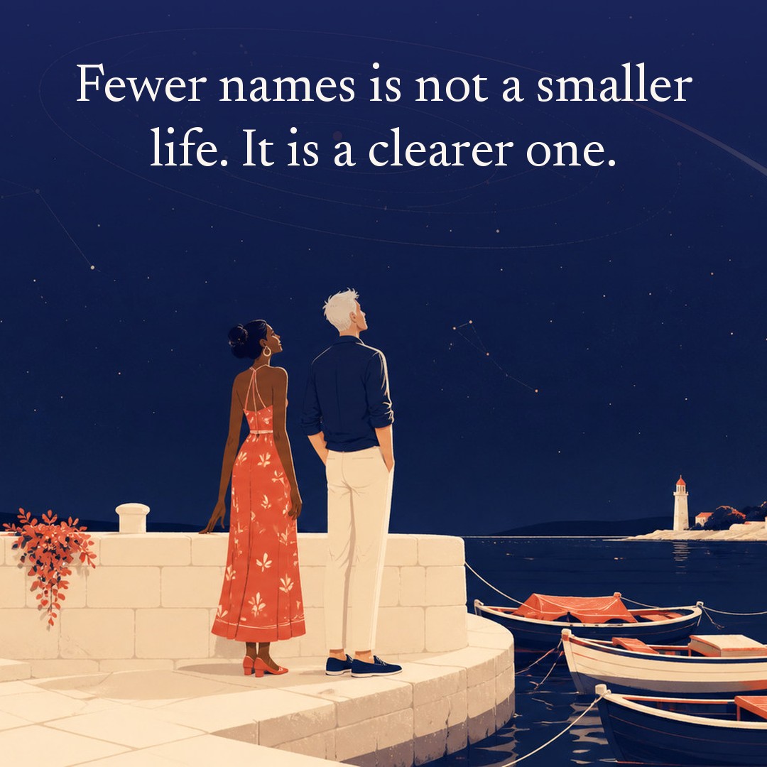 “Fewer names is not a smaller life. It is a clearer one.” A couple, two adults on a harbour wall with small moored boats below at night, beneath a vast star field, delicate constellation lines, faint concentric orbital rings and one long comet arc across a deep navy night sky, with a crescent moon low at one side.