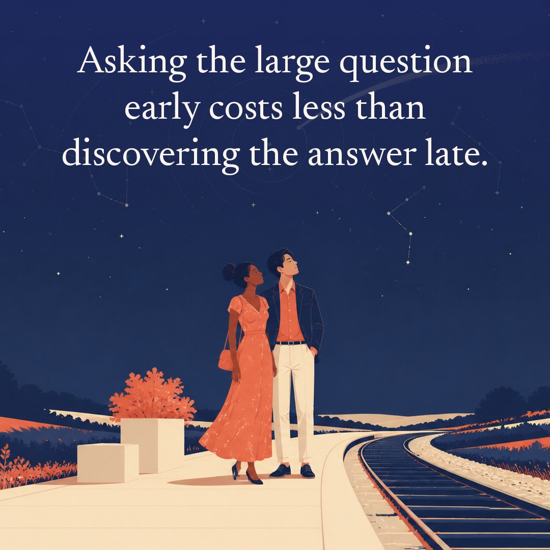 “Asking the large question early costs less than discovering the answer late.” A couple, two adults on a small rural railway platform, empty track curving away at night, beneath a vast star field, delicate constellation lines, faint concentric orbital rings and one long comet arc across a deep navy night sky, with a crescent moon low at one side.